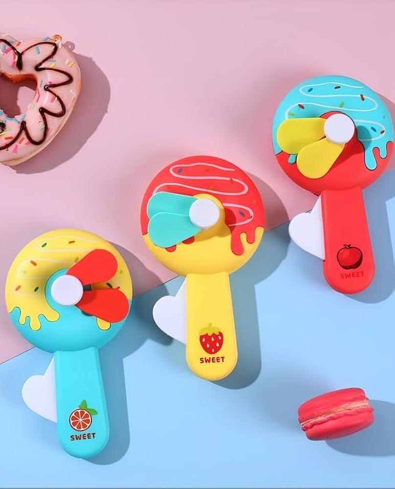 Donut Kid Fan – Cute Handheld Mini Fan for Kids | Portable Cartoon Fan for School, Travel & Outdoor Use (Random Color)